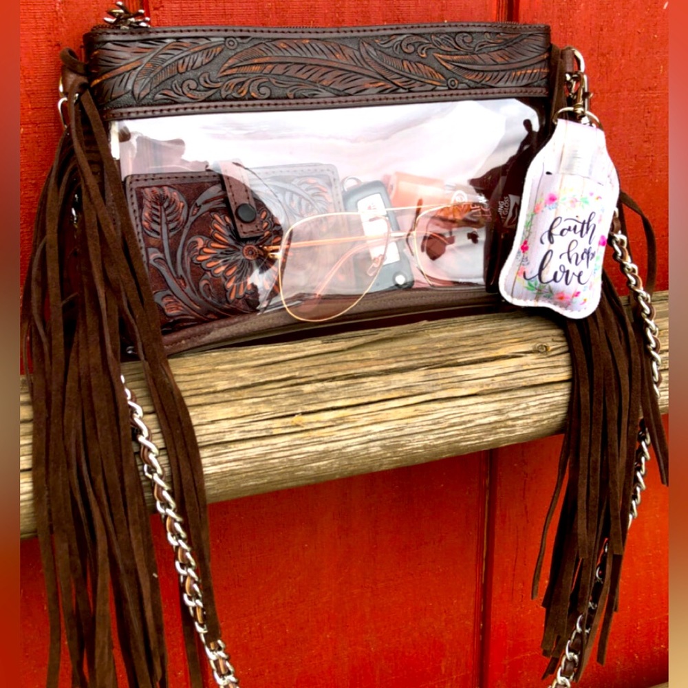 Western Bag

Carrie ” Clear Fringe Crossbody Bag / Wristlet ( Brown )